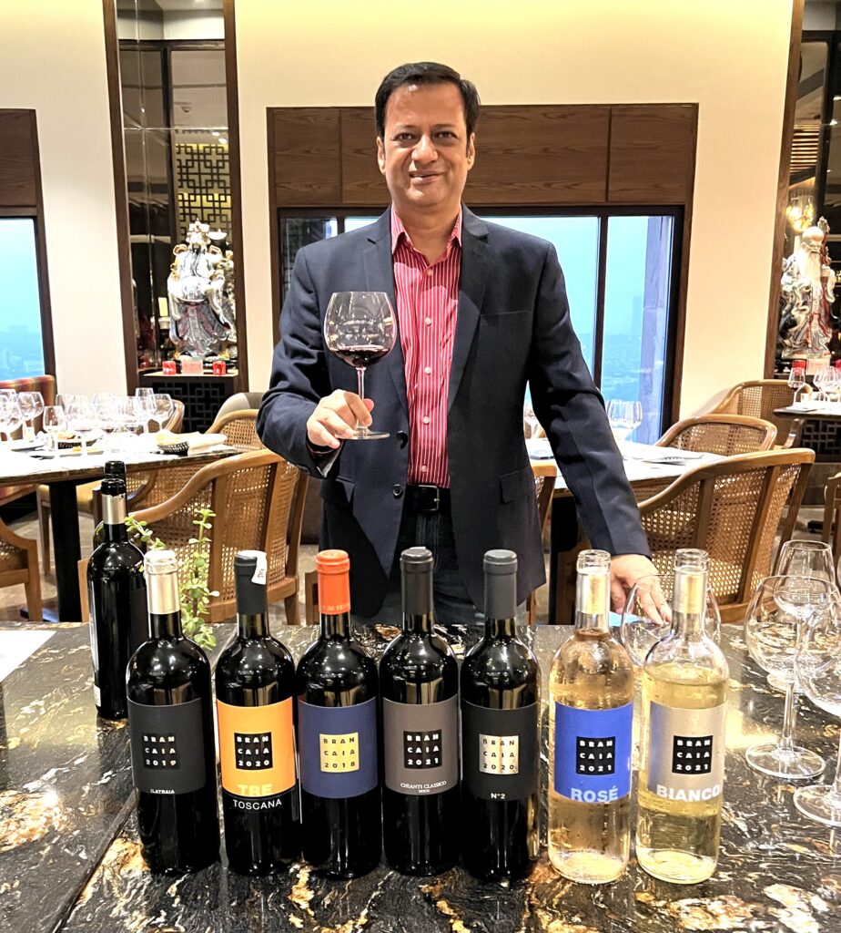 ravi-joshi-with-wine-glass-and-bottles