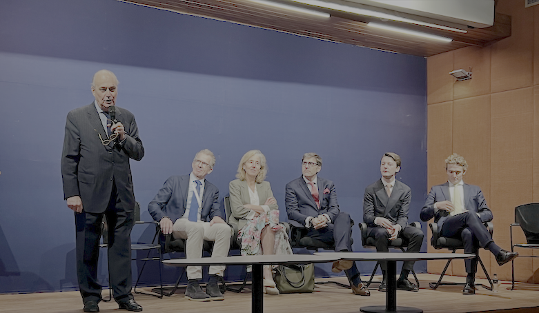 Philippe Castéja, Grands Crus delegation leader, speaking at the New Delhi event with other winery representatives seated